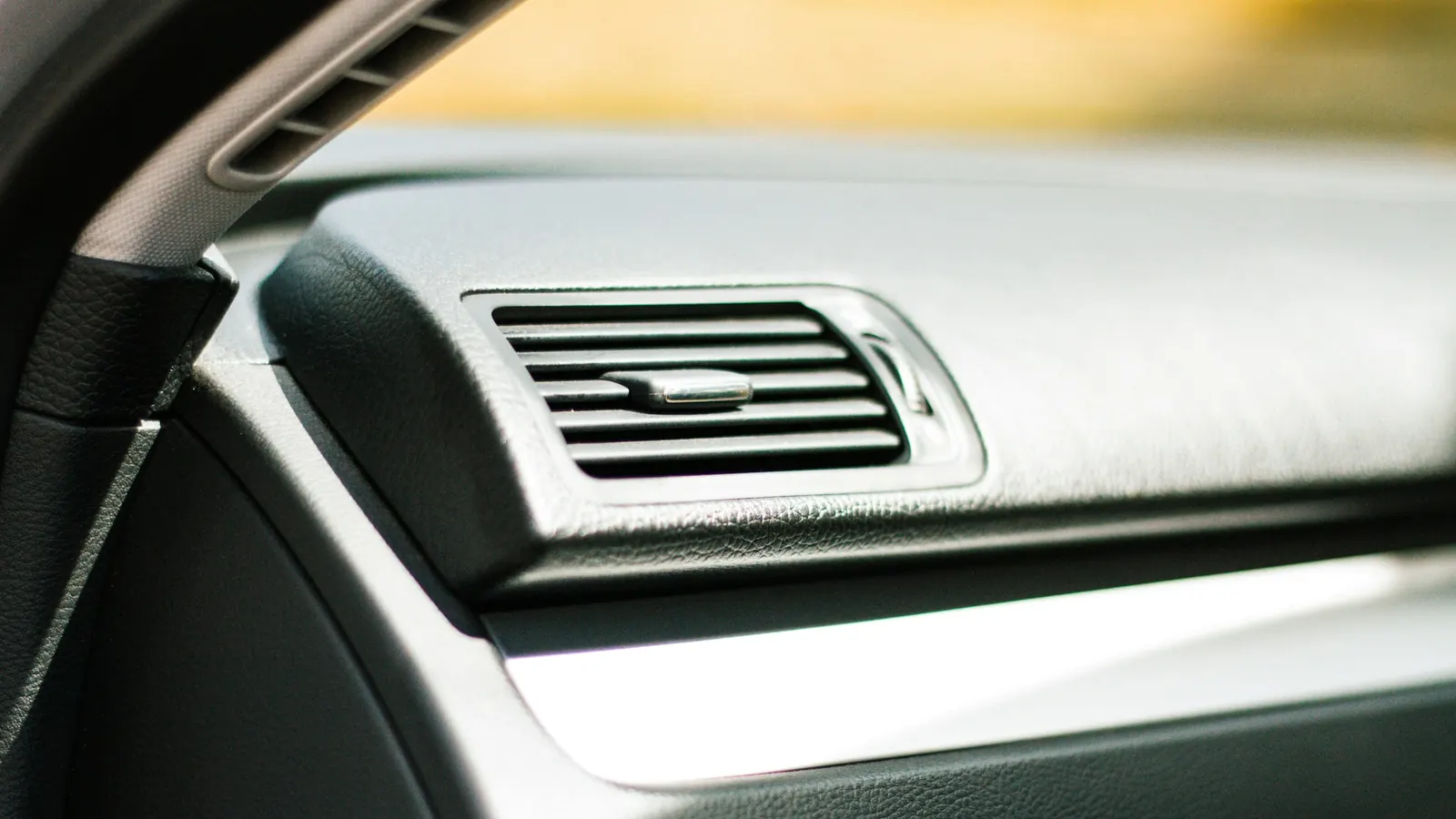 Close-up of an air vent on a car dashboard