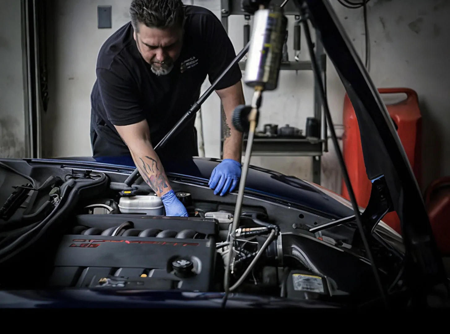 Technician working on an engine at Johnson's Auto Repair in Lake Elsinore